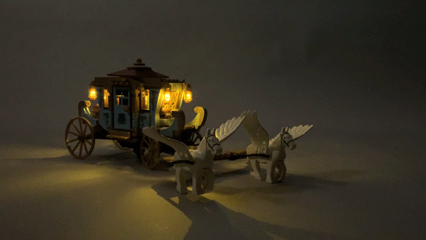 Animated gif showing flickering Brickstuff LED lights mounted inside a LEGO carriage pulled by two winged horses.