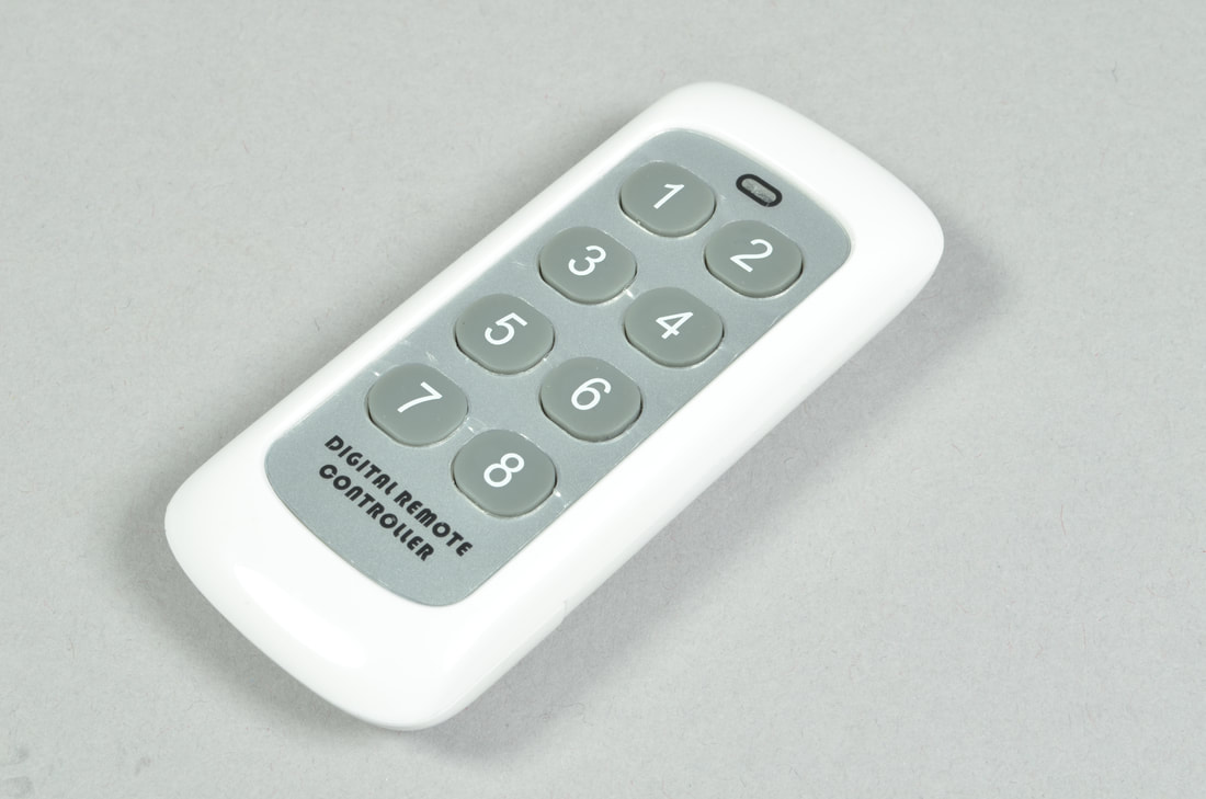 Brickstuff white 8-button remote control transmitter.